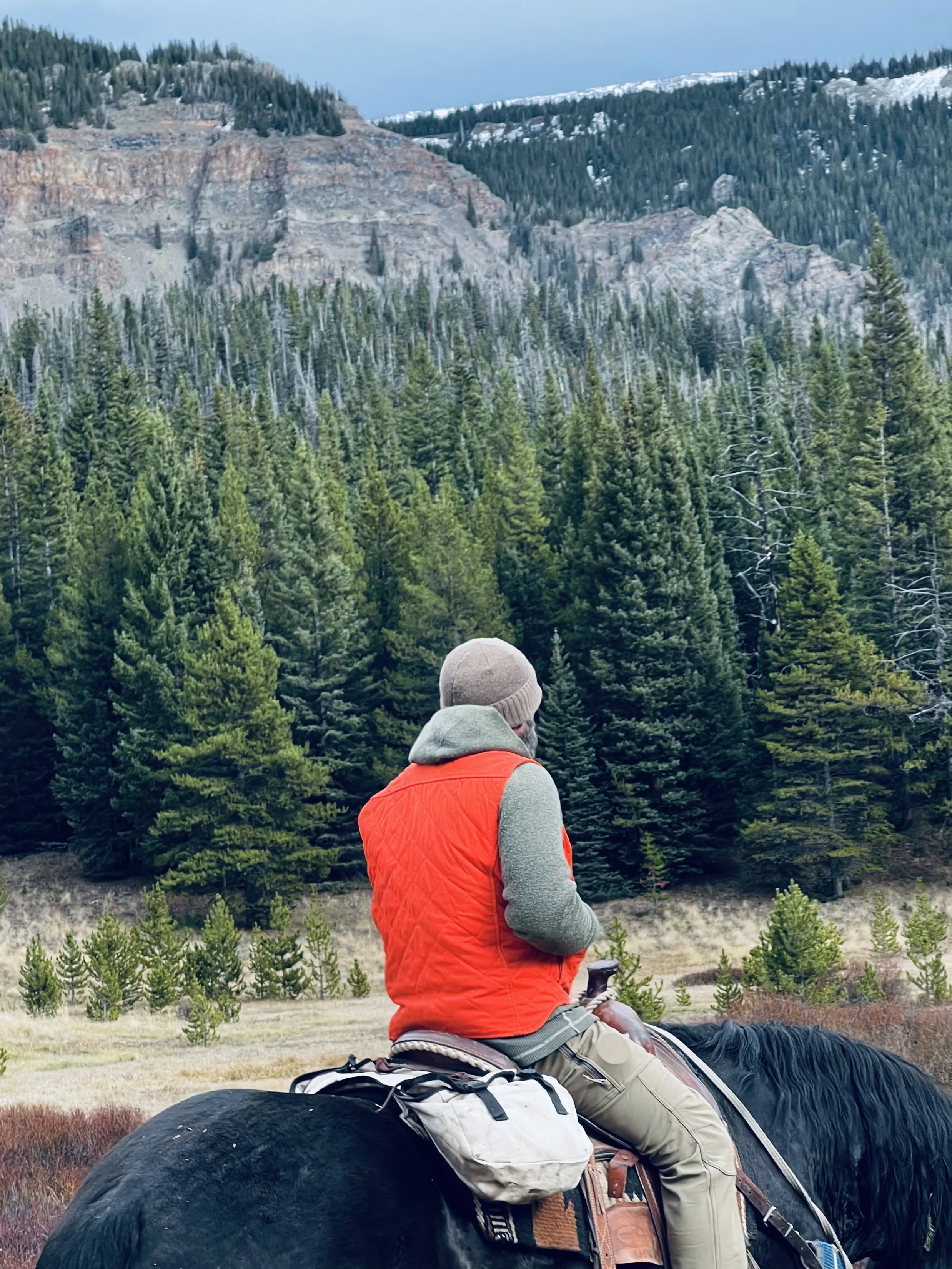 world famous hunting guide Cliff Gray wearing the Black Bear Brand HUNTING ORANGE collaboration Wax Canvas... Quilted by Hand - Ultimate Vest on a hunt.