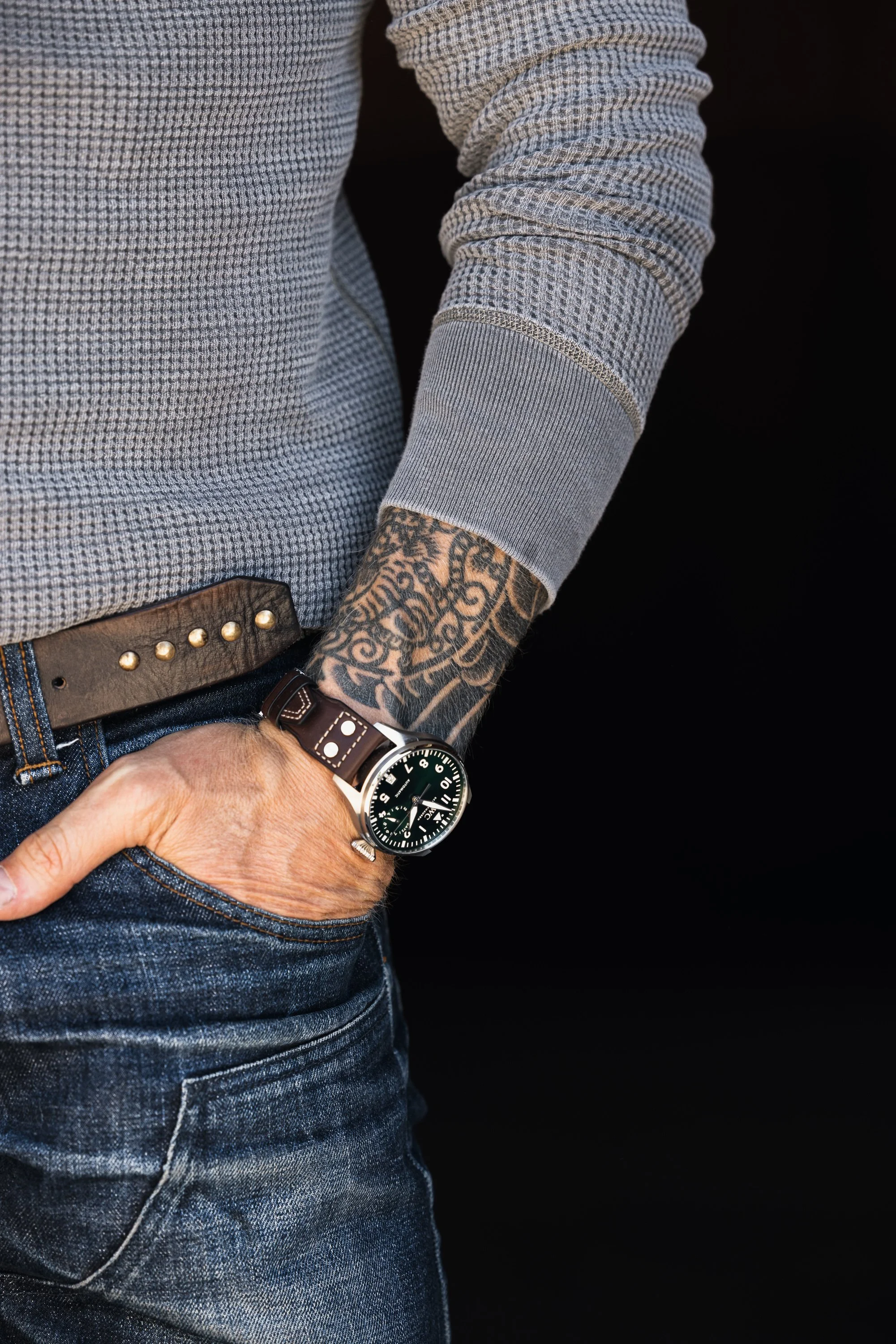 A close-up of the Black Bear Brand Luxury Thermal's custom branded shell buttons. The buttons are neatly aligned and bear the Black Bear Brand insignia.