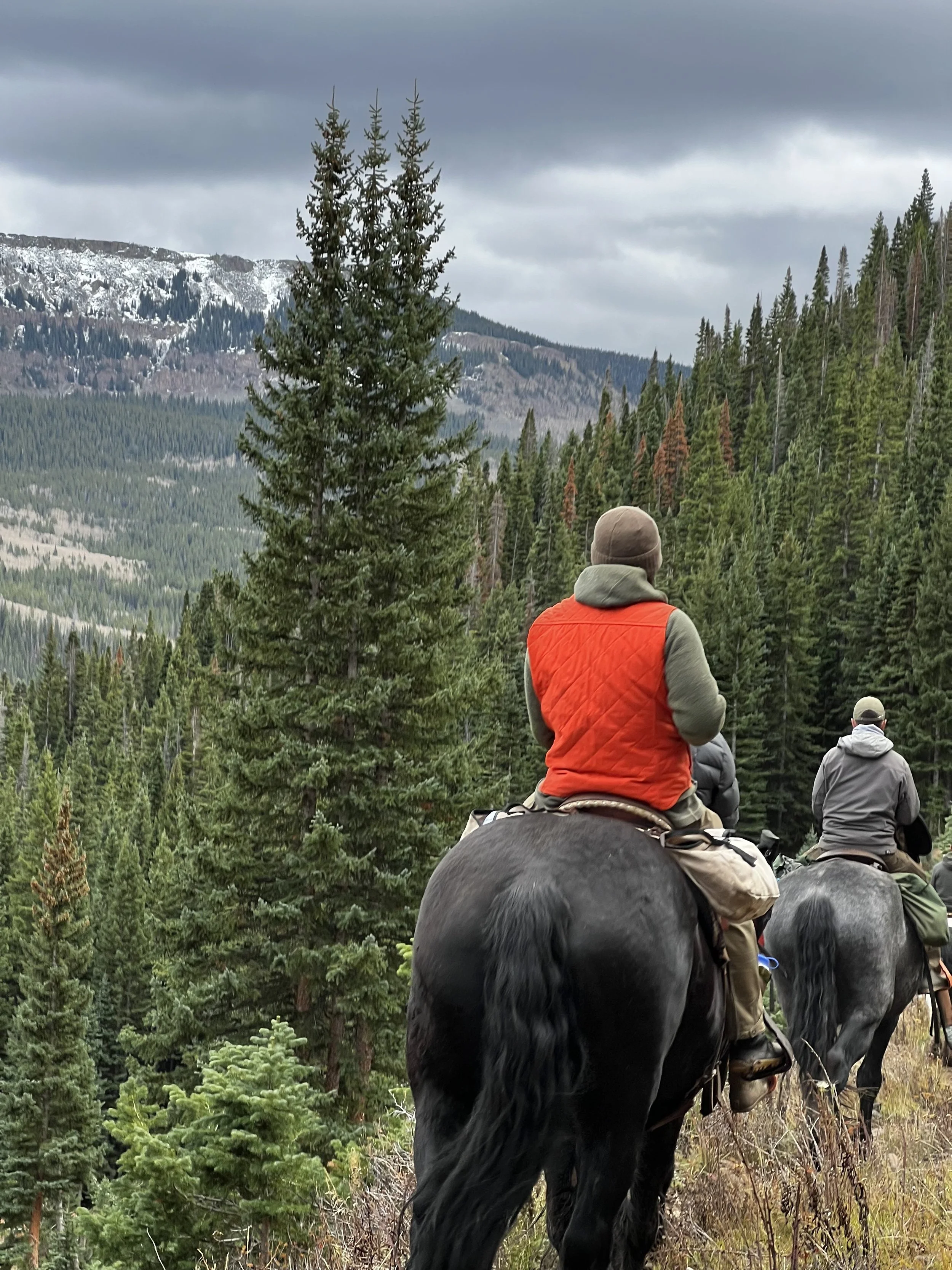 world famous hunting guide Cliff Gray wearing the Black Bear Brand HUNTING ORANGE collaboration Wax Canvas... Quilted by Hand - Ultimate Vest on a hunt.