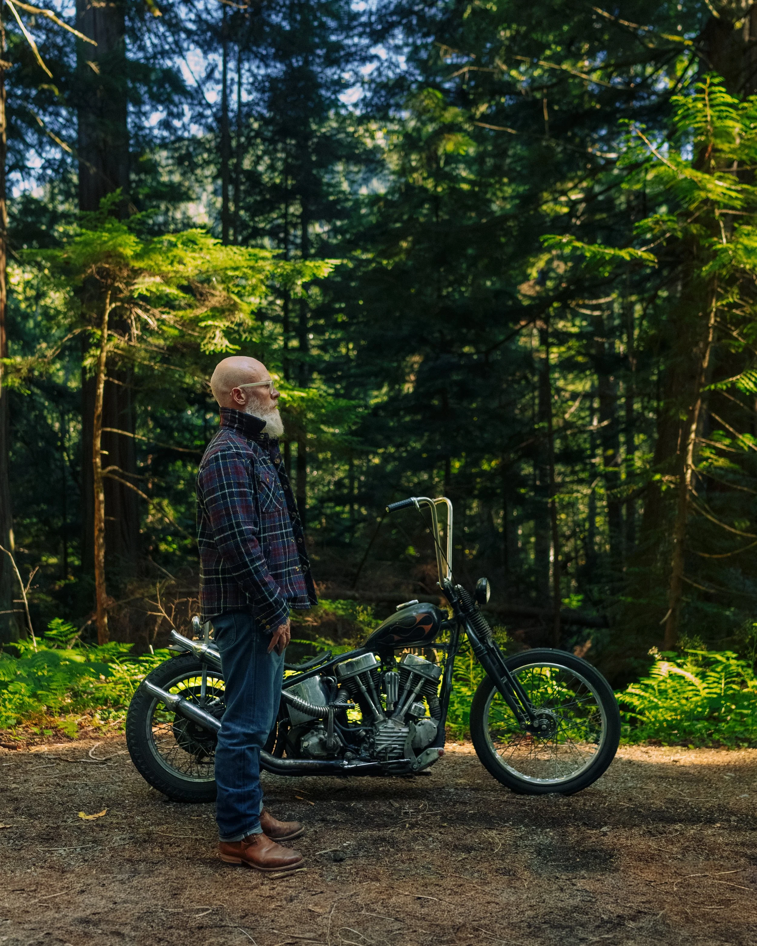 Black_Bear_Brand-midnight-glen-tartan-harristweed-western-jacket forest profile with chopper.jpg