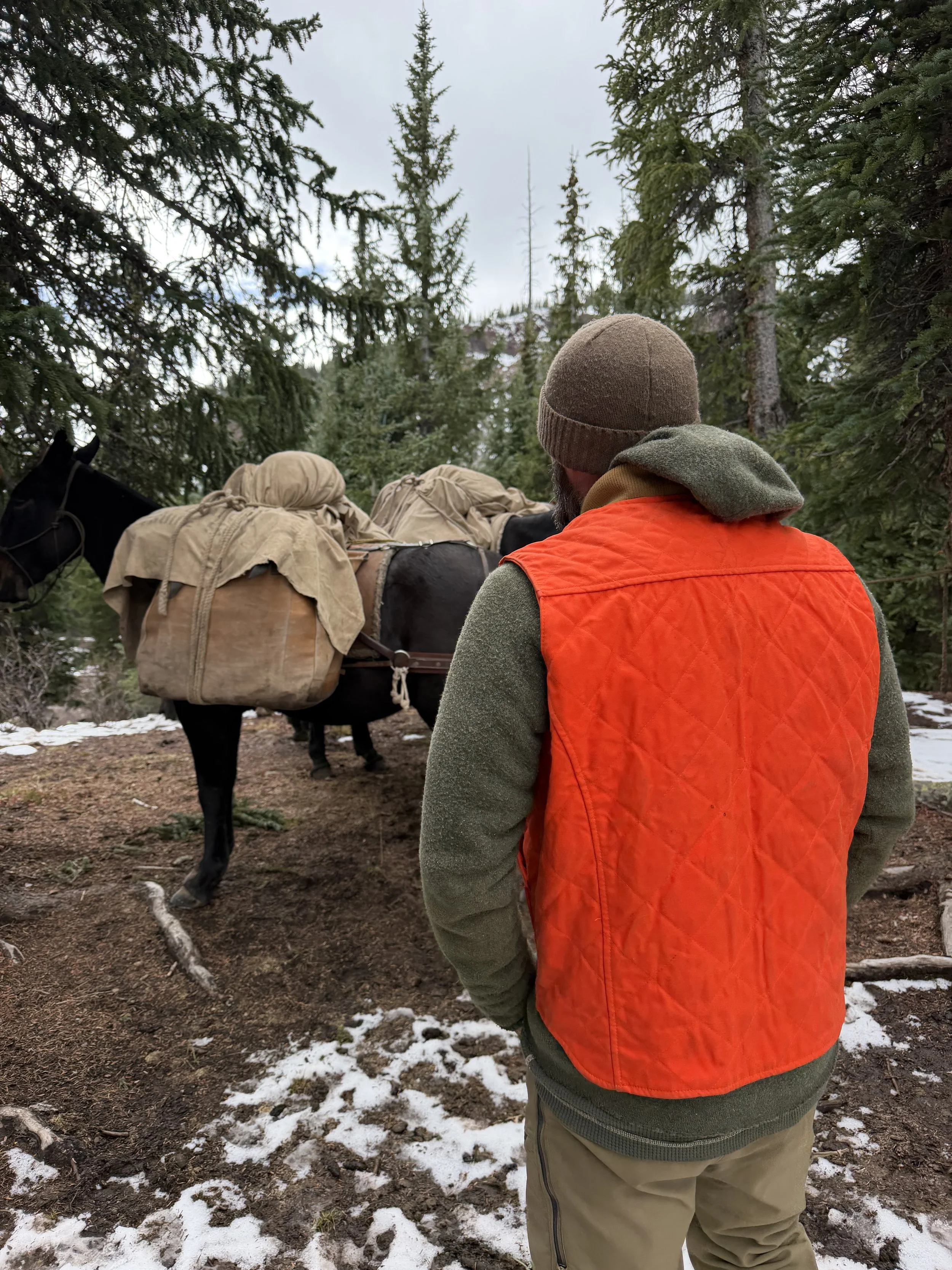 world famous hunting guide Cliff Gray wearing the Black Bear Brand HUNTING ORANGE collaboration Wax Canvas... Quilted by Hand - Ultimate Vest on a hunt.