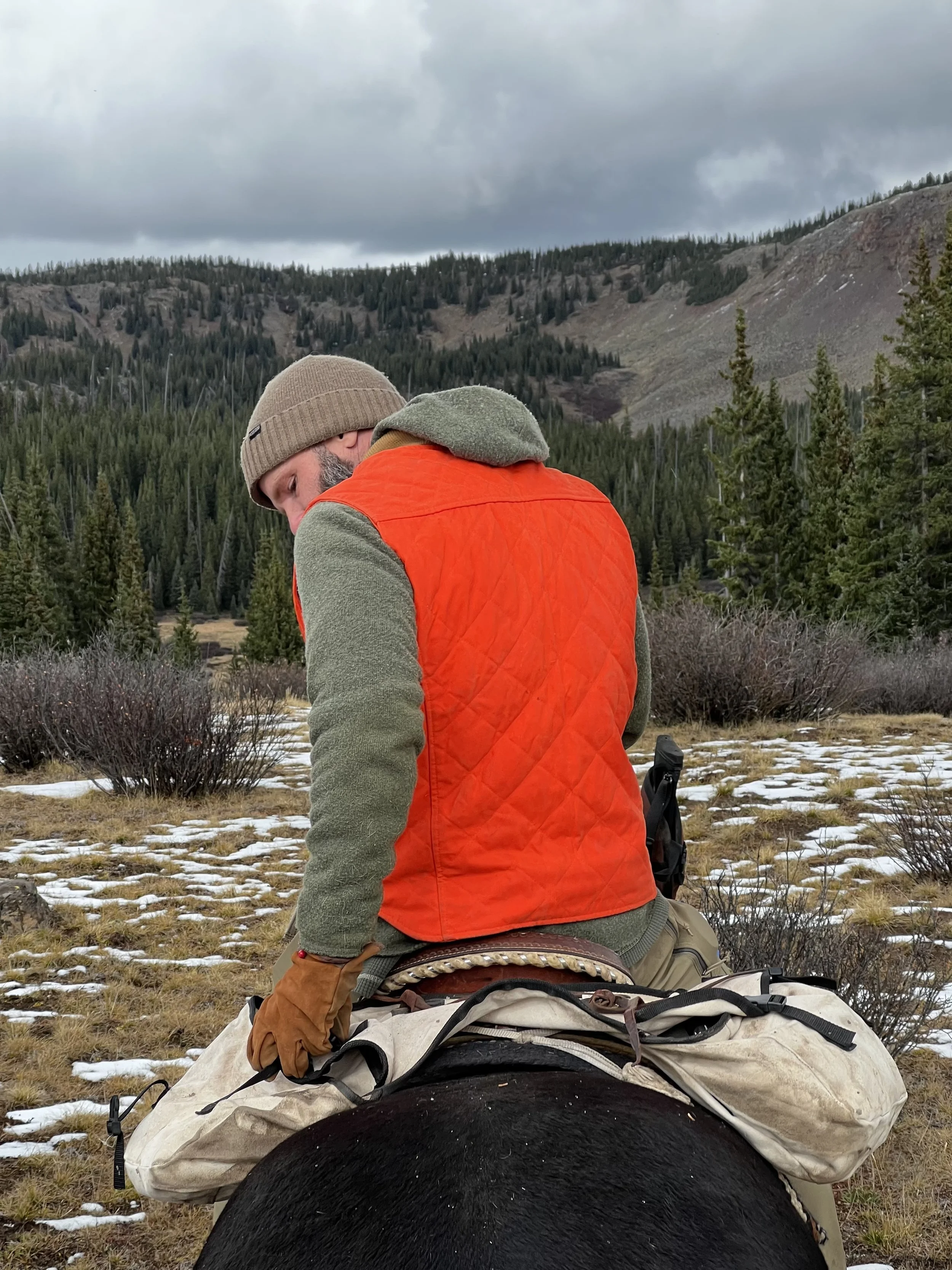 world famous hunting guide Cliff Gray wearing the Black Bear Brand HUNTING ORANGE collaboration Wax Canvas... Quilted by Hand - Ultimate Vest on a hunt.