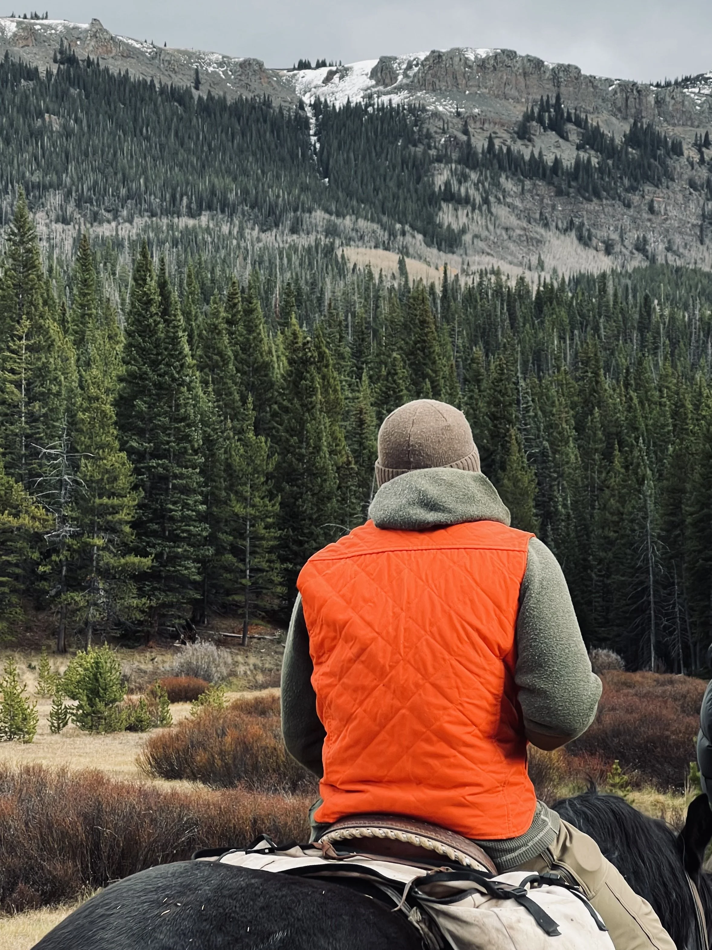 world famous hunting guide Cliff Gray wearing the Black Bear Brand HUNTING ORANGE collaboration Wax Canvas... Quilted by Hand - Ultimate Vest on a hunt.