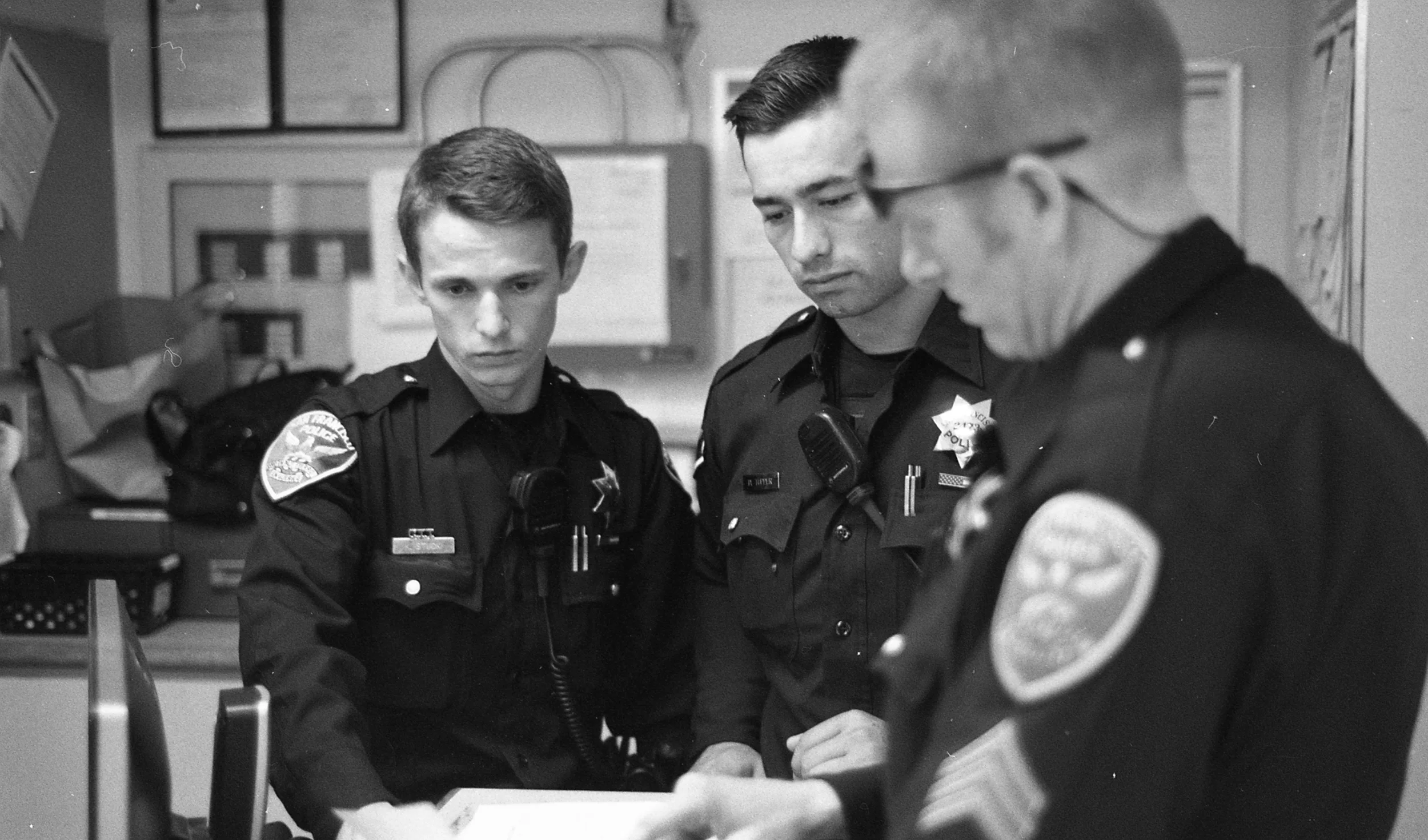 Sergeant Joshua Kumli, a field training sergeant, teaches two new recruits how to conduct a preliminary narcotics lab test for methamphetamine. Earlier in the day, Sergeant Kumli made an arrest for a stolen car. The persons involved were found in possesion of the methamphetamine. Since the department’s drug lab scandal in 2010, all officers must conduct a preliminary narcotics lab test in the field in an effort to weed out corruption on the force. Once tested, the arresting officer must bring the narcotics and the test results to the crime lab. This was the first field narcotics lab test for the recruits, who, after spending 31 weeks at the police academy, were in the beginning of their 17-week field training program. This is one of the longest training programs for police officers in the United States.