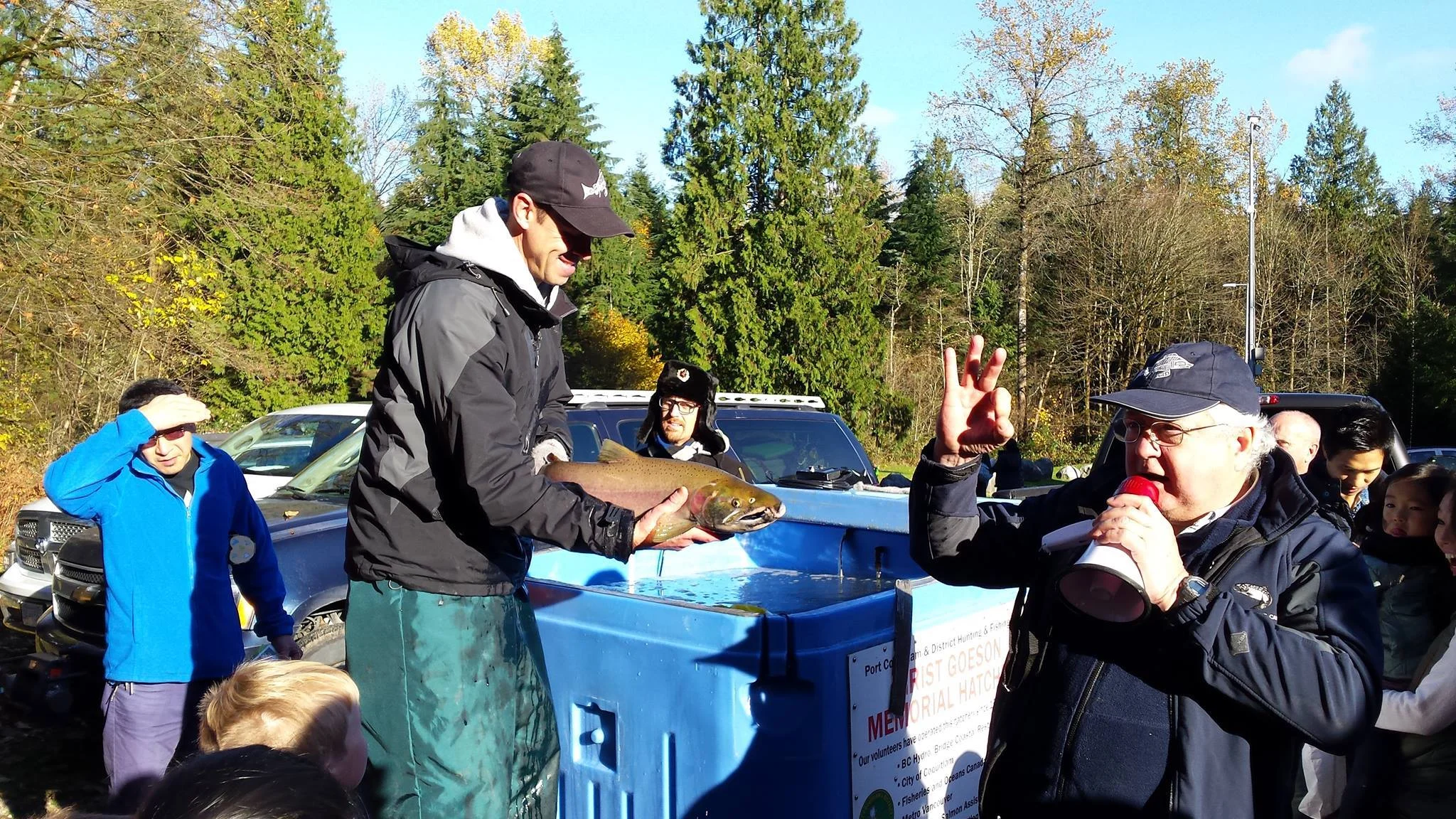 Scott and Maurice from the Department of Fisheries show live coho salmon and answer questions