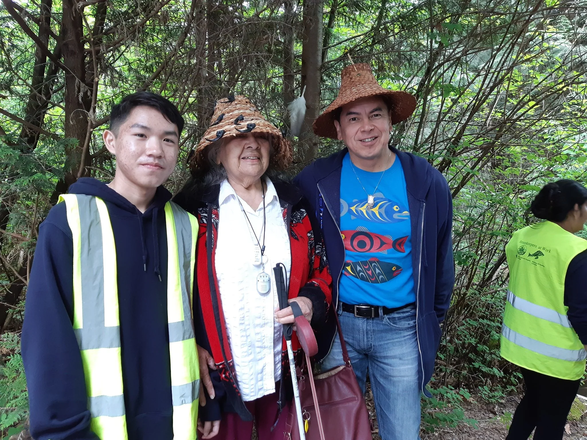 Salmon Leave Home 2019 at Hoy Creek Hatchery - Left to right: Pinetree student, Lucas; Elder Beverly and Chief Ed Hall of Kwikwetlem First Nation . (Photo: HSWS)