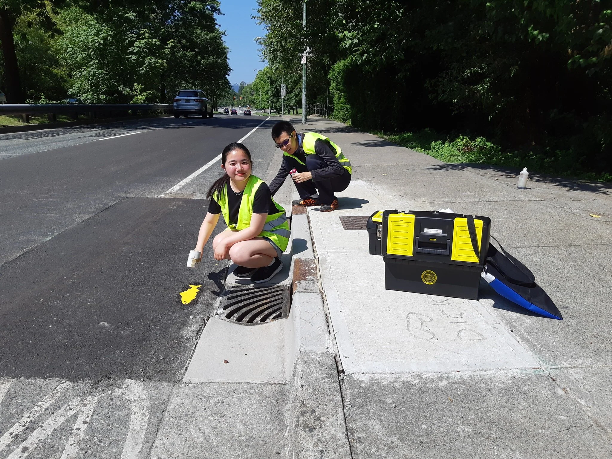 Ririka and Steven doing storm drain marking