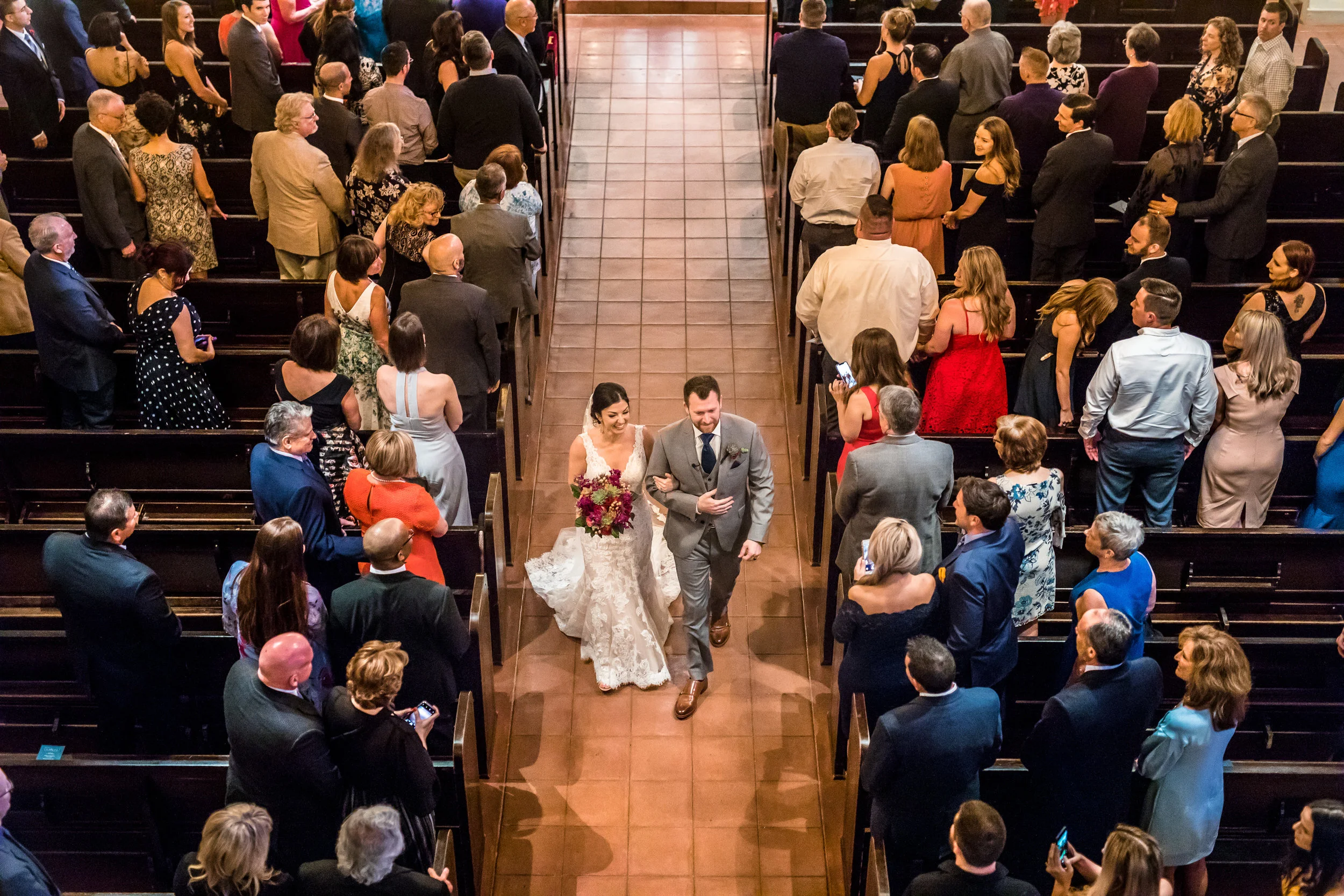 12 bride and groom leaving ceremony bride and groom walking down the aisle officially Mr and Mrs Ben and Kelly Photography Life Design Events .jpg