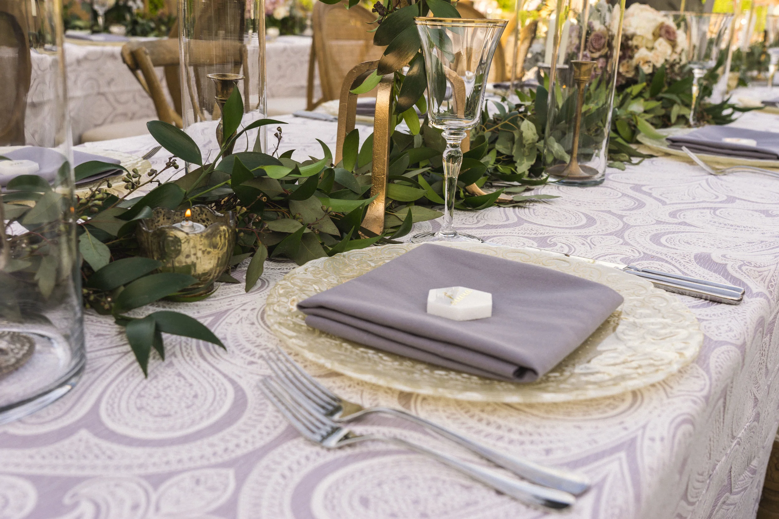 9 place setting dinner table purple napkin candlelight dinner placecard tile Life Design Events photos by Keith and Melissa Photography.jpg