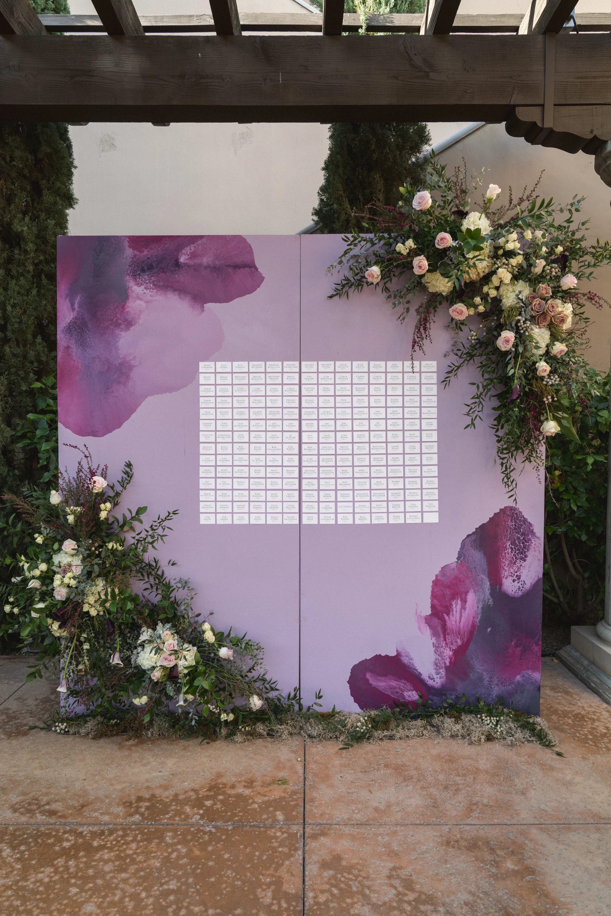 12 purple floral painted escort wall escort card display assigned seating dinner Life Design Events photos by Keith and Melissa Photography.jpg