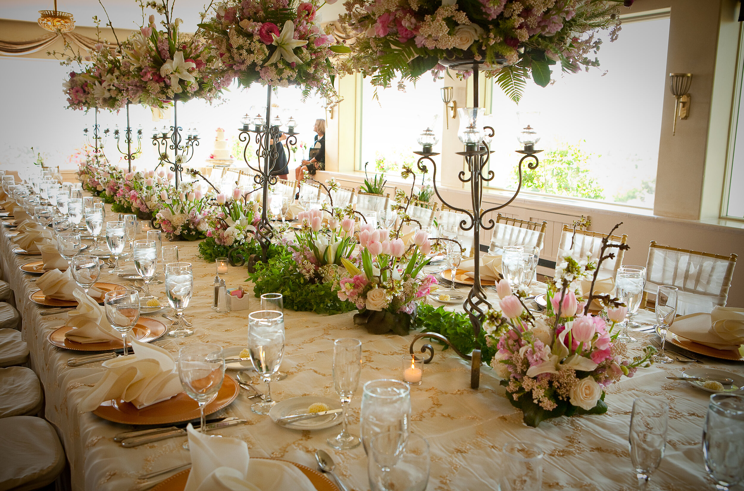 4 spring centerpieces pink and white rose centerpieces tall floral centerpieces long reception table Harrison Hurwitz photography Life Design events.jpg