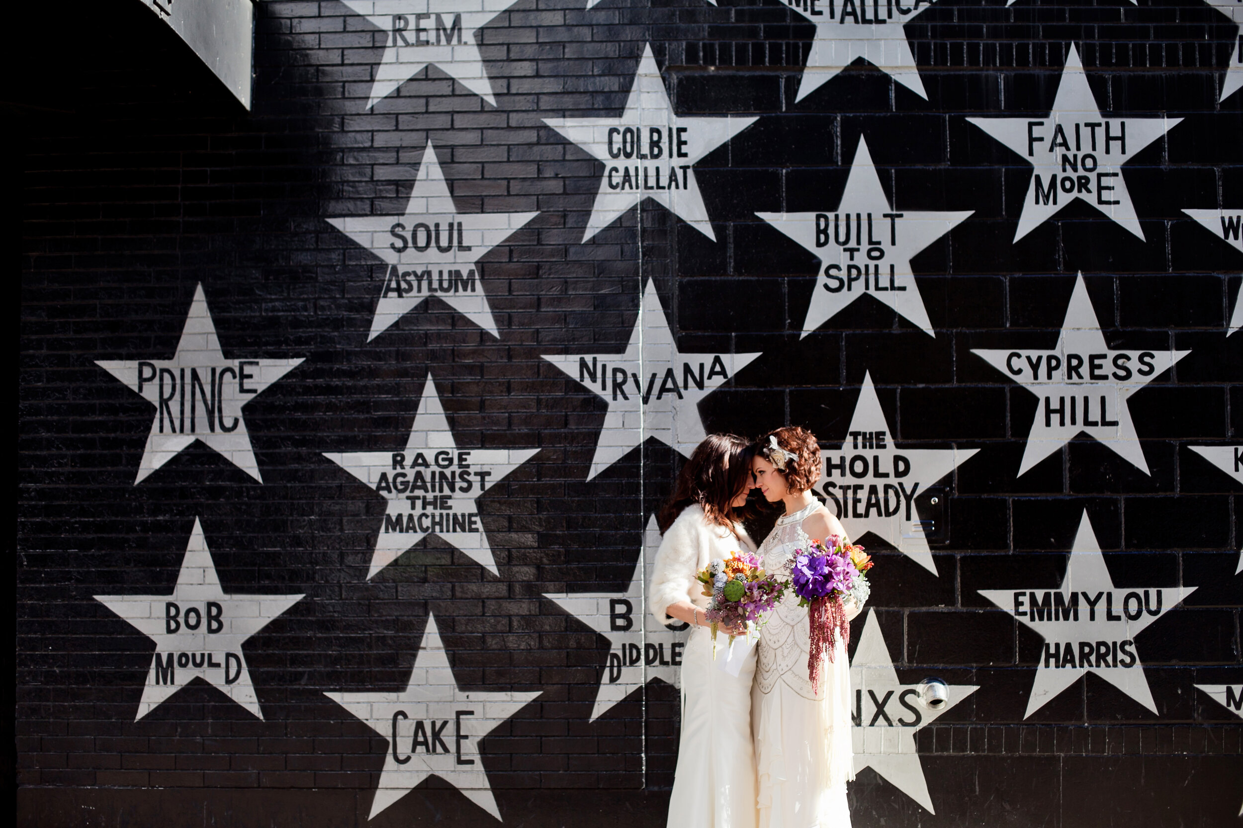 16 two brides star wall music wall unique wedding back drops candid first look shots Life Design Events .jpg