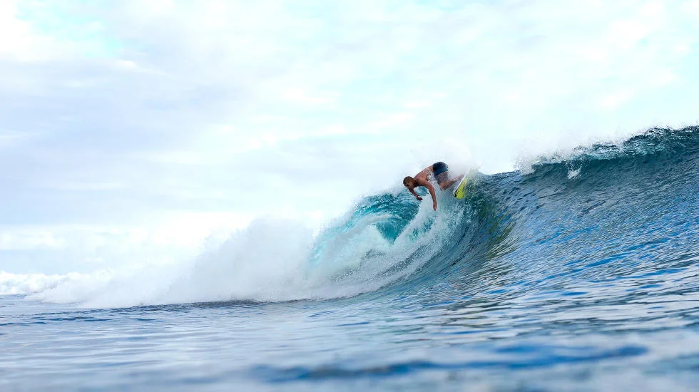 Mick Fanning dips his fins in the waters at Teahupo'o. Photo c/o WSL and Kelly Cestari