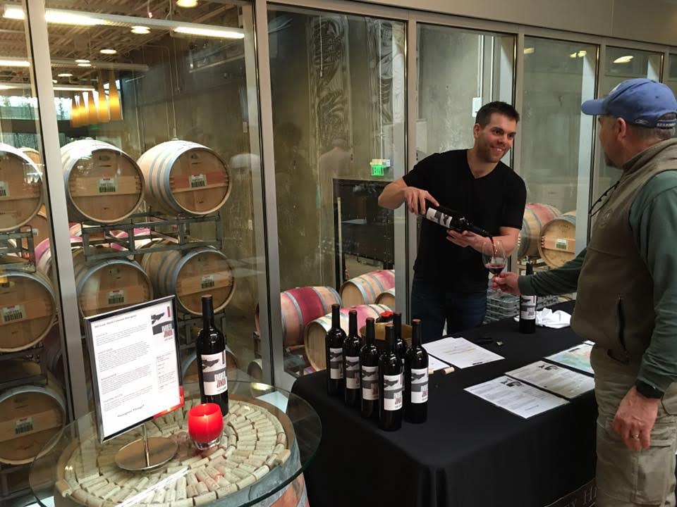 Andrew Januik pouring his wines.jpg