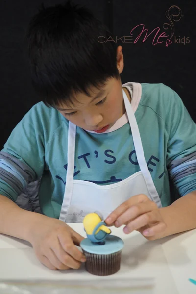 An eleven year old concentrating hard on perfecting his minion