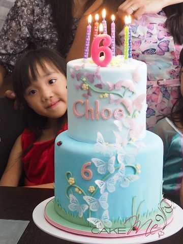 My shy little niece, Chloe, hiding behind her cake.