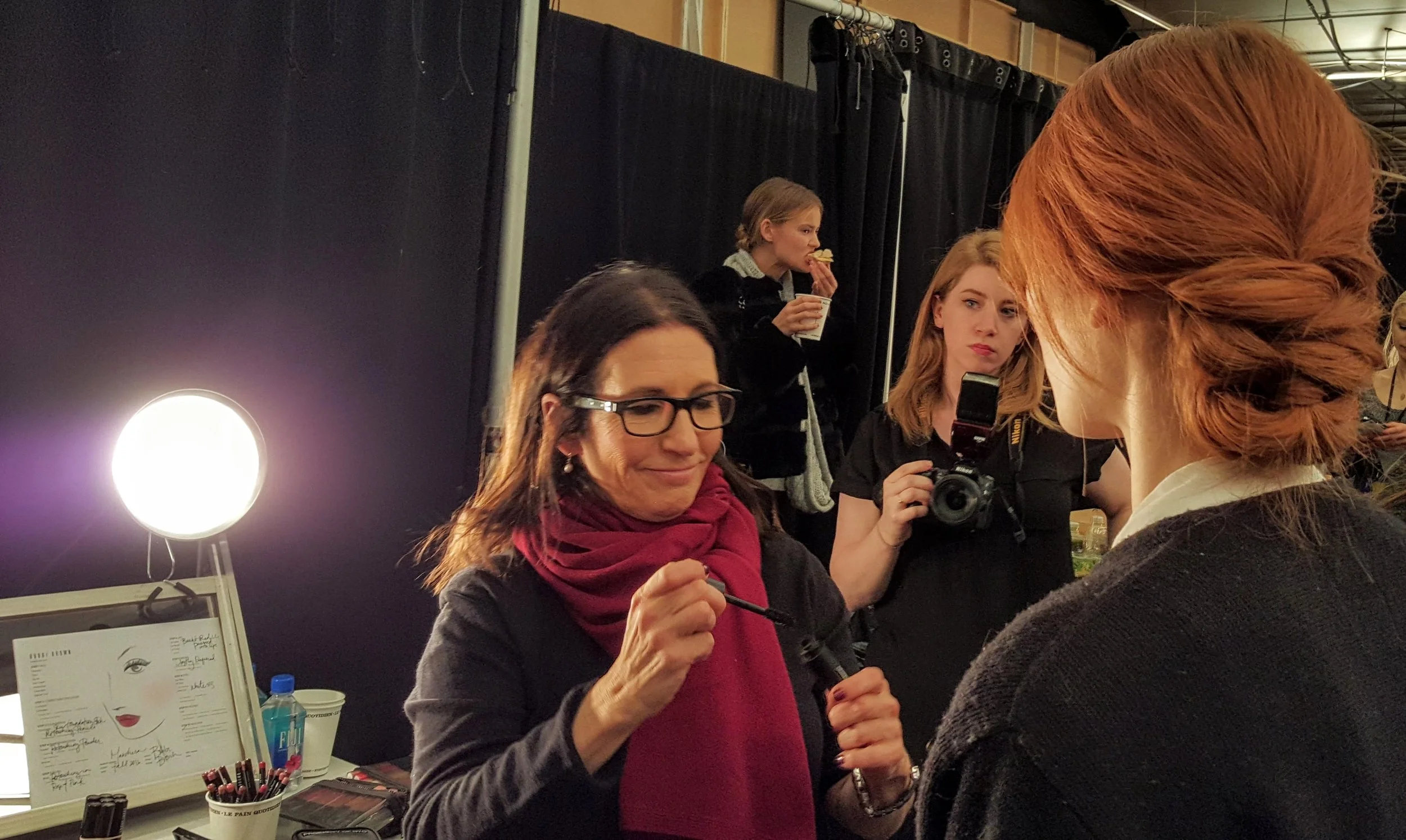 Brown discusses the subdued look, a rose lip and minimal eye. With long red hair, this model's chignon was especially striking - but I am a fan of red hair.