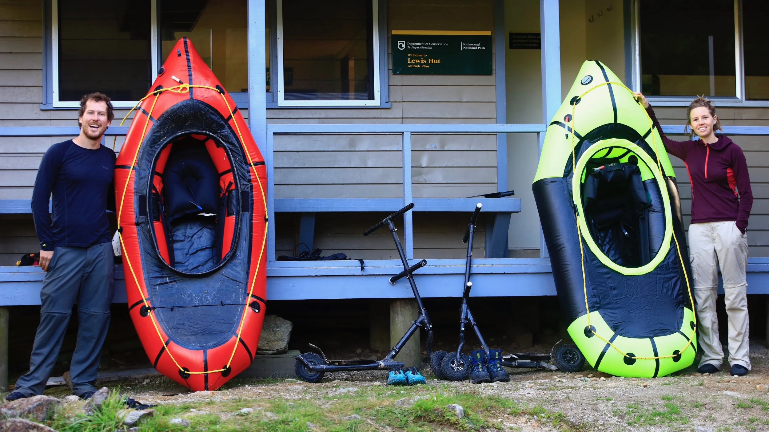 Standing with scooters and rafts at Heaphy Hut, NZ