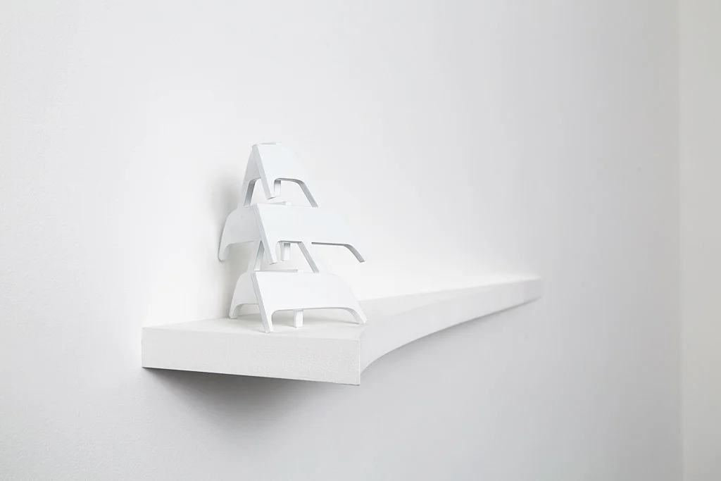 Material Dreams , 2015, powder coated laser cut stainless steel, laser cut MDF, 120 x 21 x 20cm.