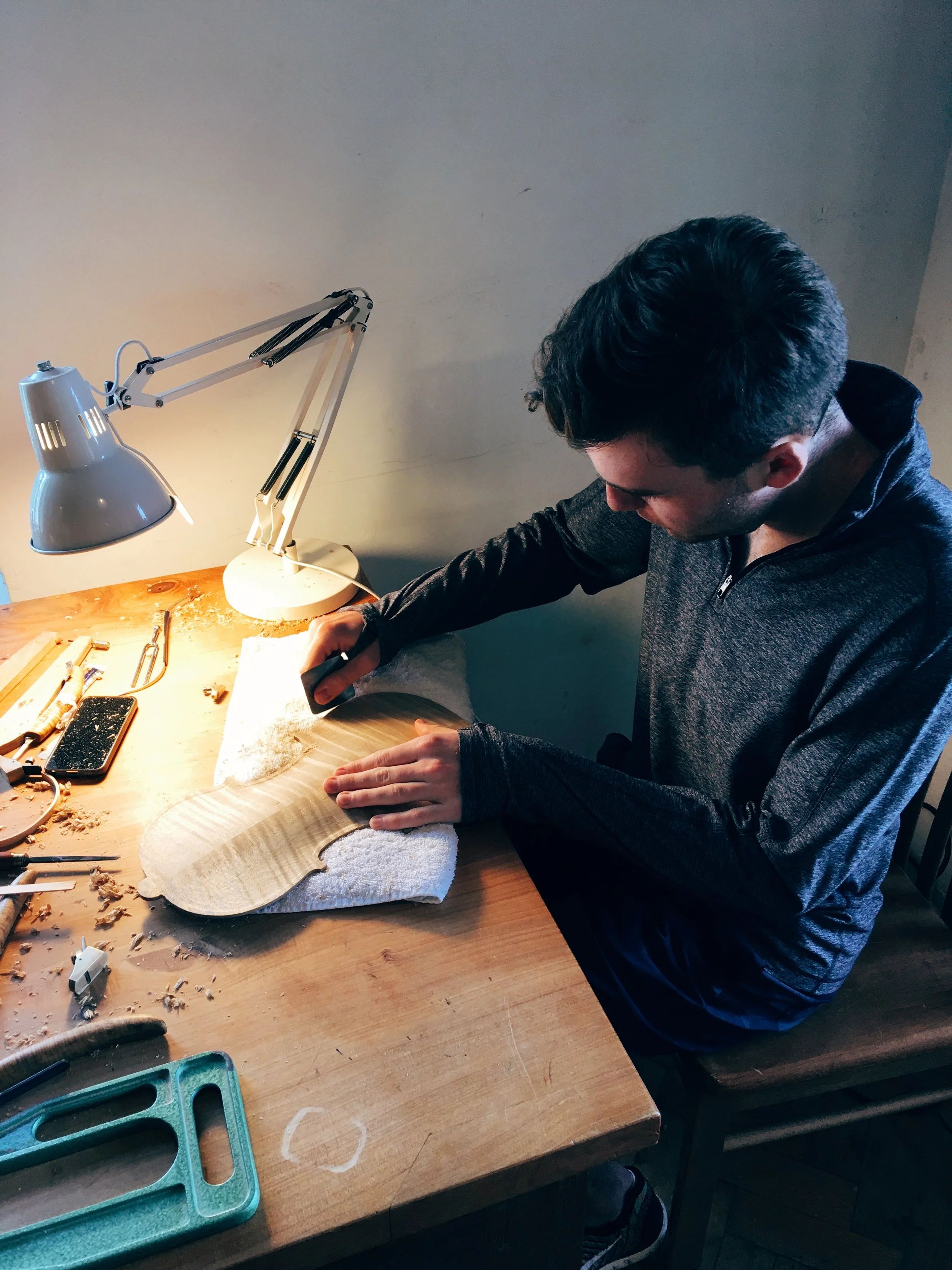 Alexi Kenney working on the Prussia Cove violin, under strict moderation by Peter Greiner