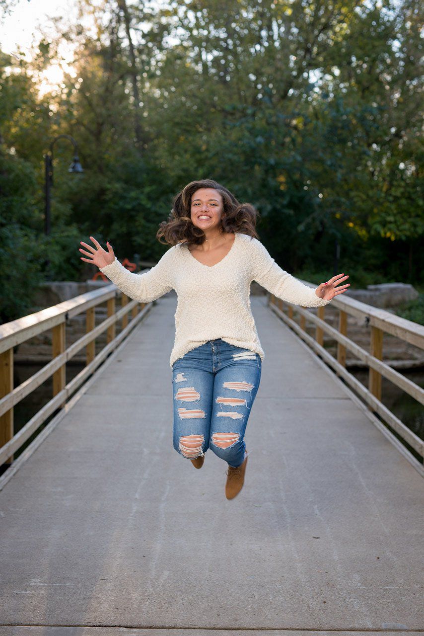 Jumping on a bridge Senior Portrait