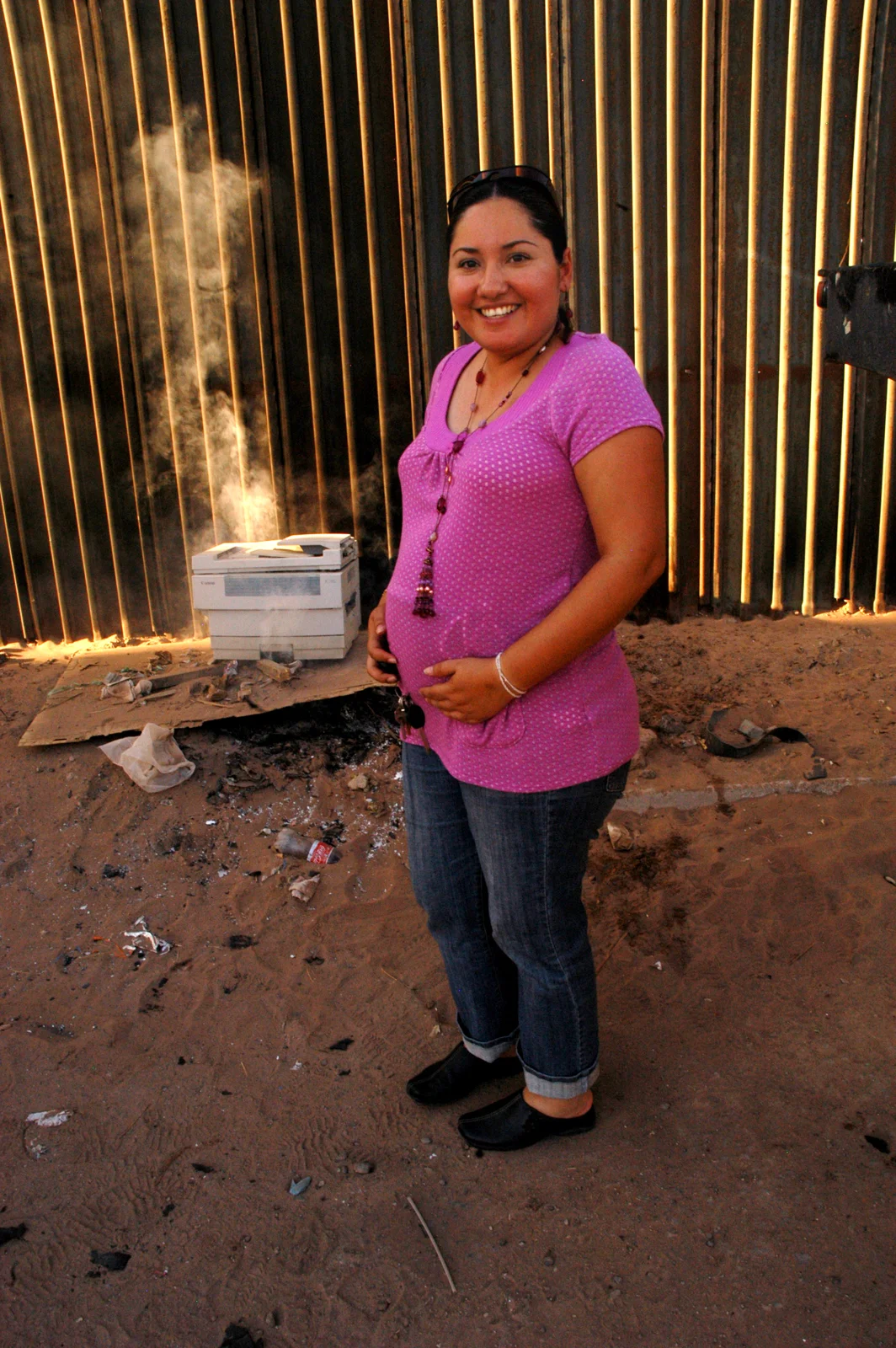 Yadira says "En realidad no hay muro. Todos somos iguales." "In reality, there is no wall. We are all the same." At the border fence in Mexicali, Baja California, Mexico.