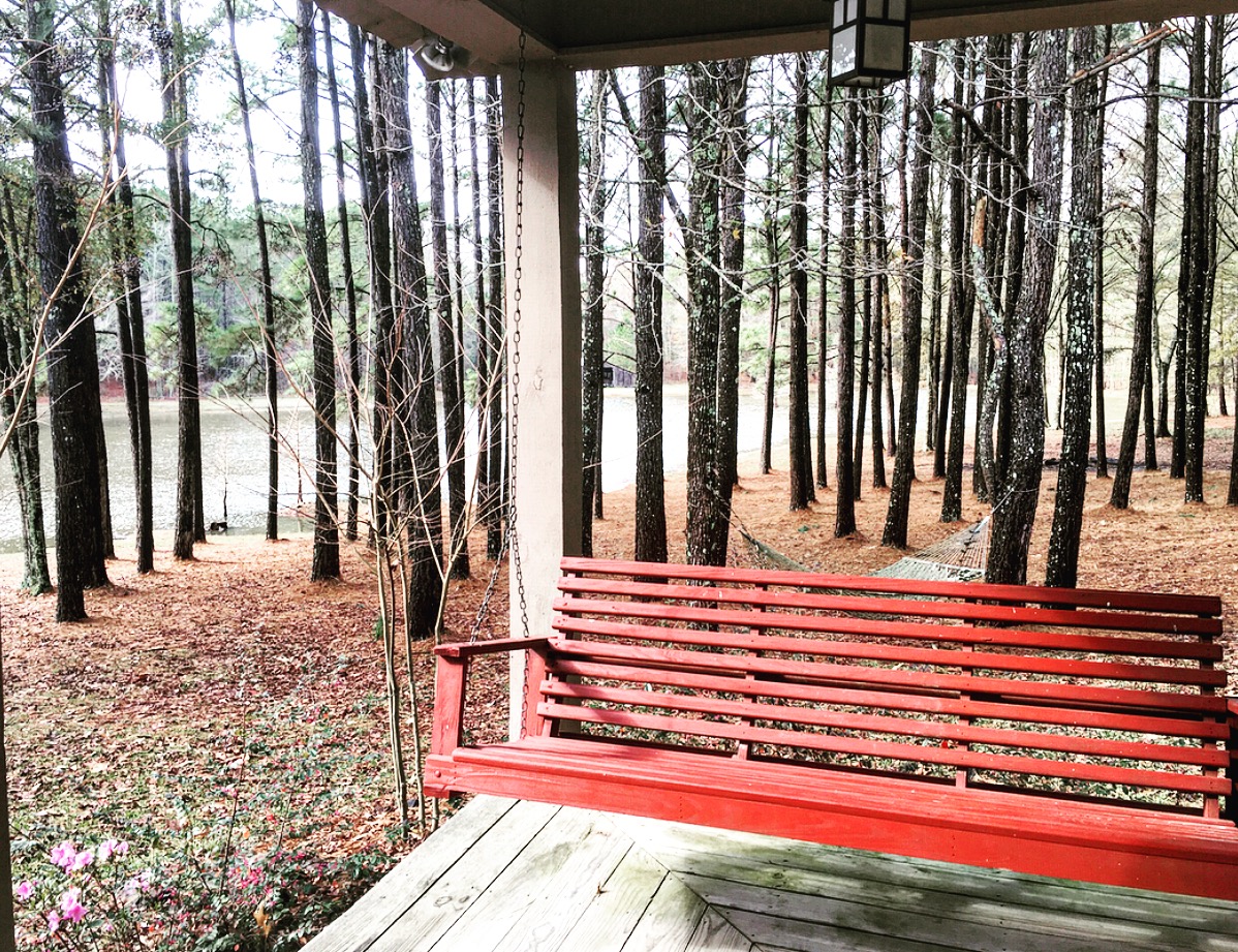 View from across the lake to the last standing chicken house on the property from the cabin.