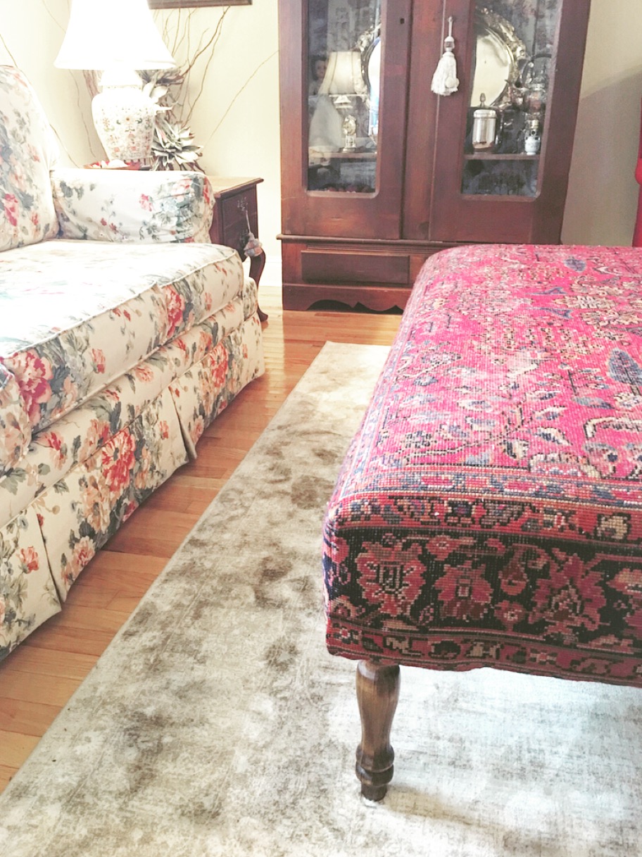 Mother-in-Law, Kathryn's Sitting Room off the Kitchen featuring an antique armoire, new viscose rug, and rug ottoman!
