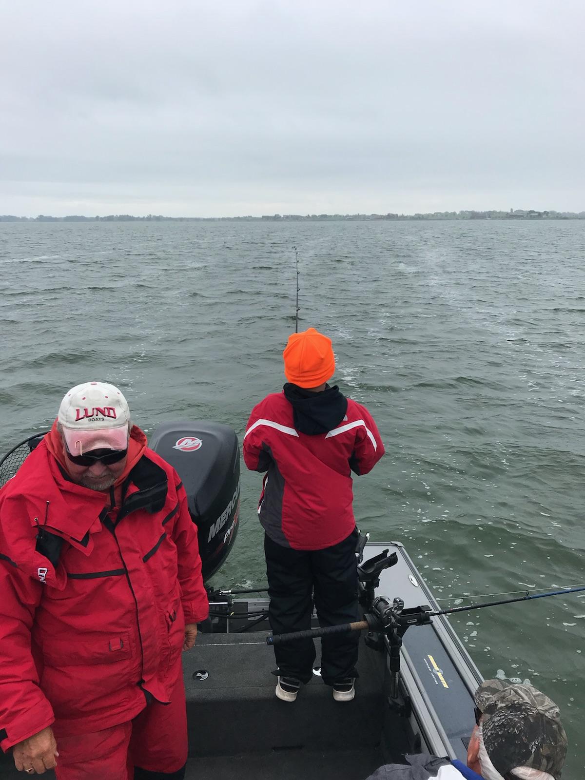 11 year old Weston reeling in another walleye.