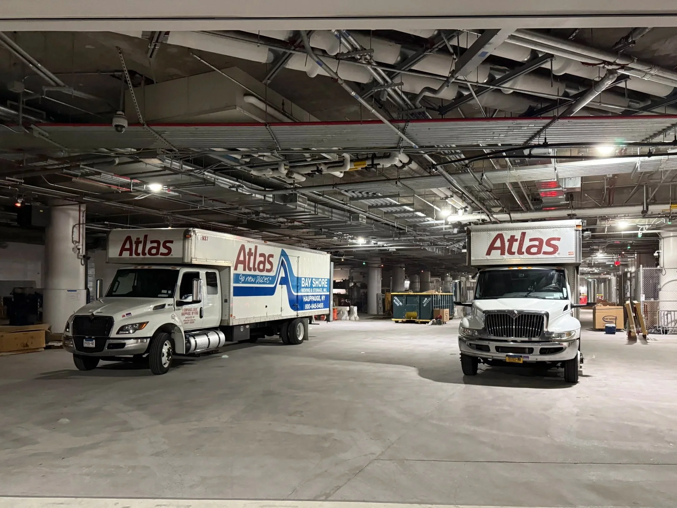 Two Trucks in a parking garage