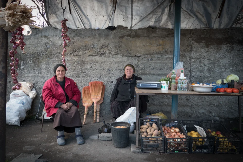 The town's vegetable stall. These two only smile when the camera is away! 