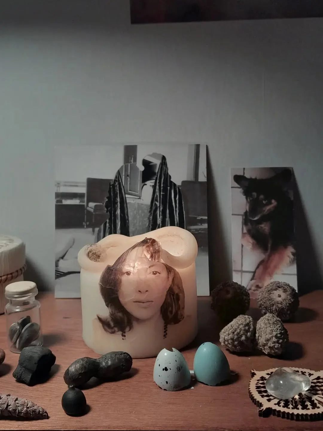 Desktop shrine : Joan Didion candle @creamguillotine collage, Ai Weiwei ceramic Sunflower Seeds, Wijnand de Jonge cast bronce peanut, Eastern Bluebird egg, Song Thrush egg, female comes of Lebanese cedar, clear quartz blob, photo of my dearly loved d