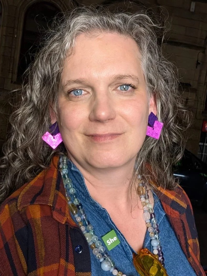 picture of Meg smiling gently at the camera