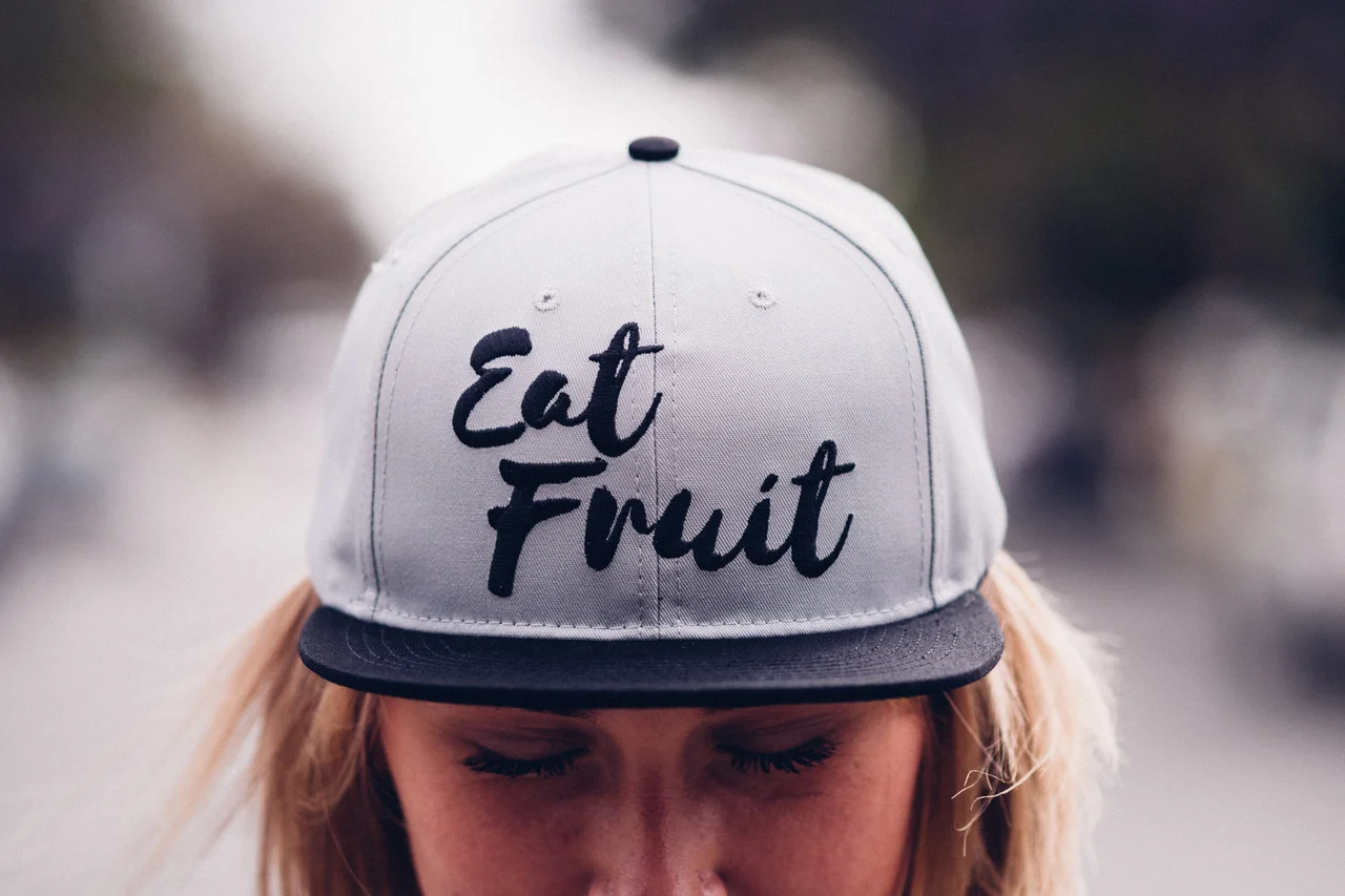 Reese Arden teamed up with Vegan YouTuber Kate Fruit Flowers to bring a limited edition vegan snapback ball cap. © Anthony Reese Schneider