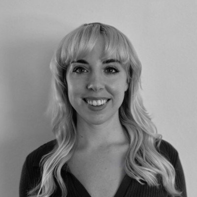 maddie may blonde Caucasian woman smiling in black and white photo