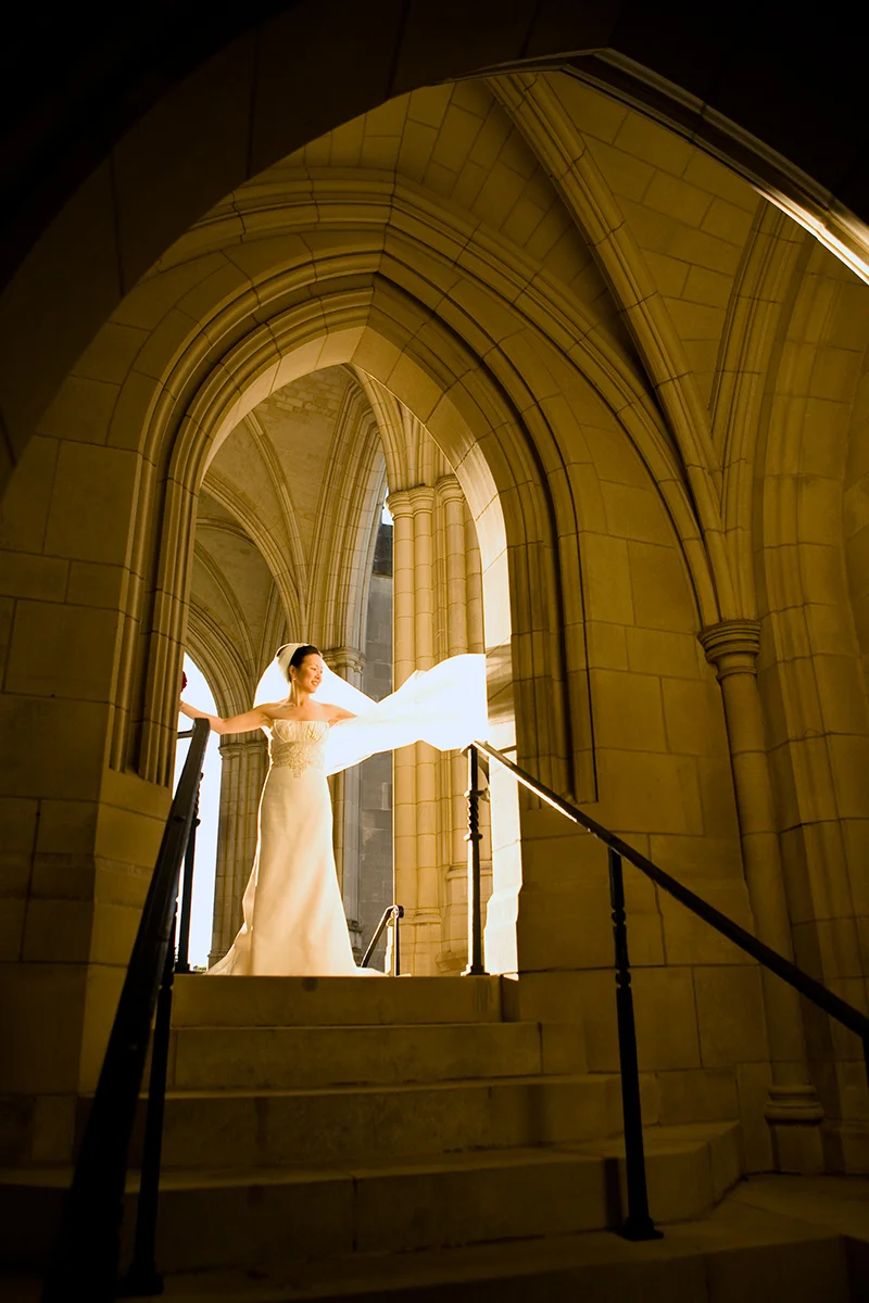 Bride in the wind at National Cathedral in Washington, DC