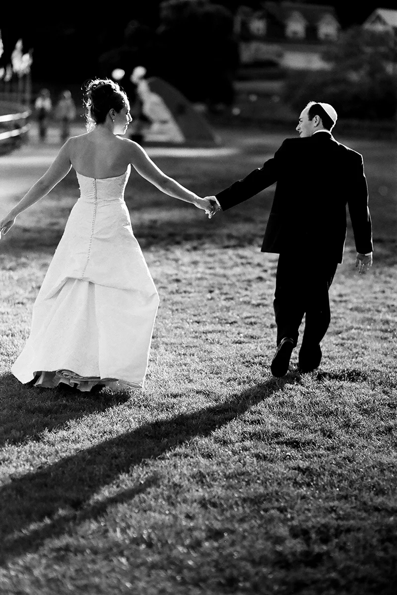 Bride and groom exit the ceremony just after the kiss at Rosario Resort on Orcas Island, WA