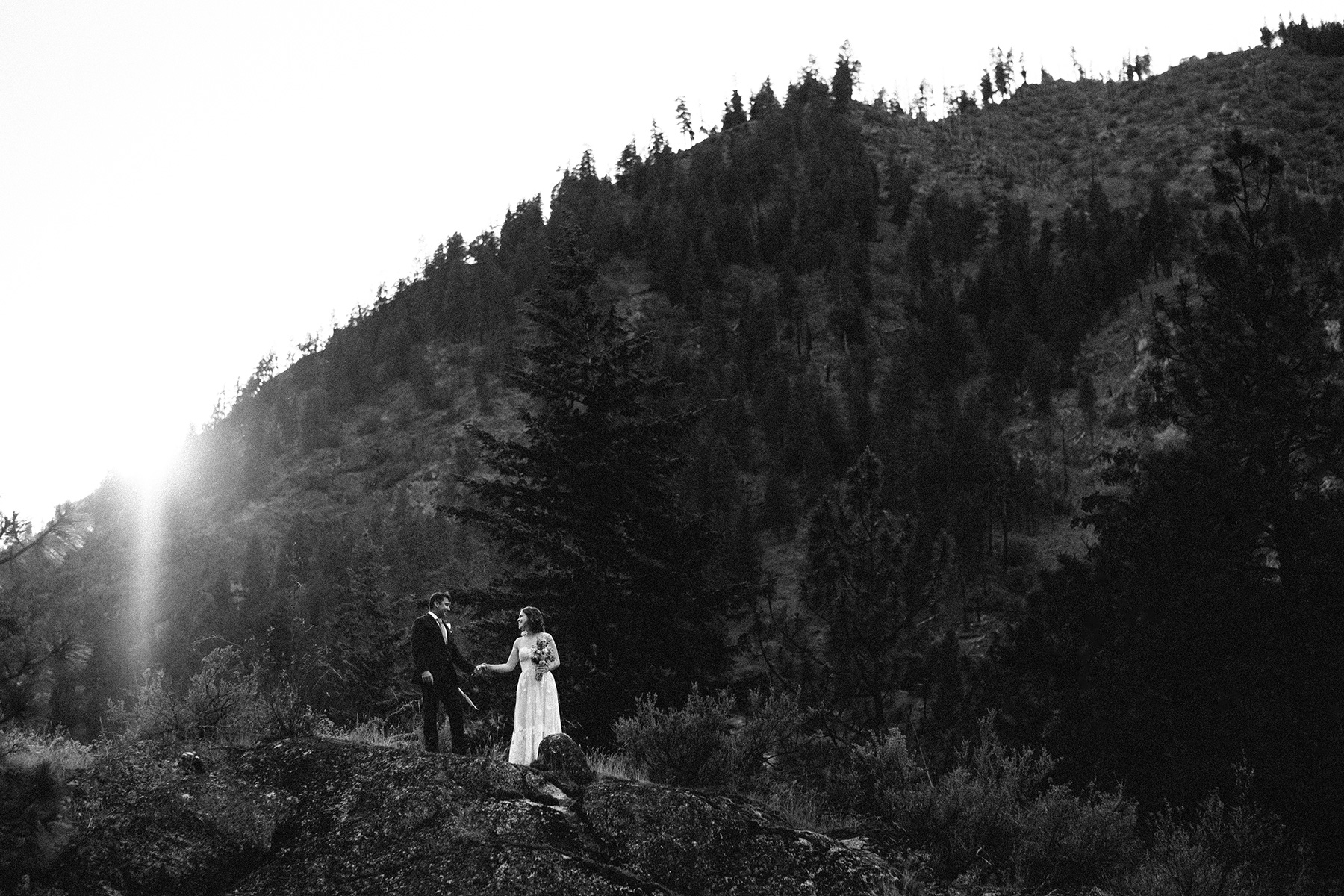 Couple on the bluffs at sunset at wedding in Leavenworth, WA