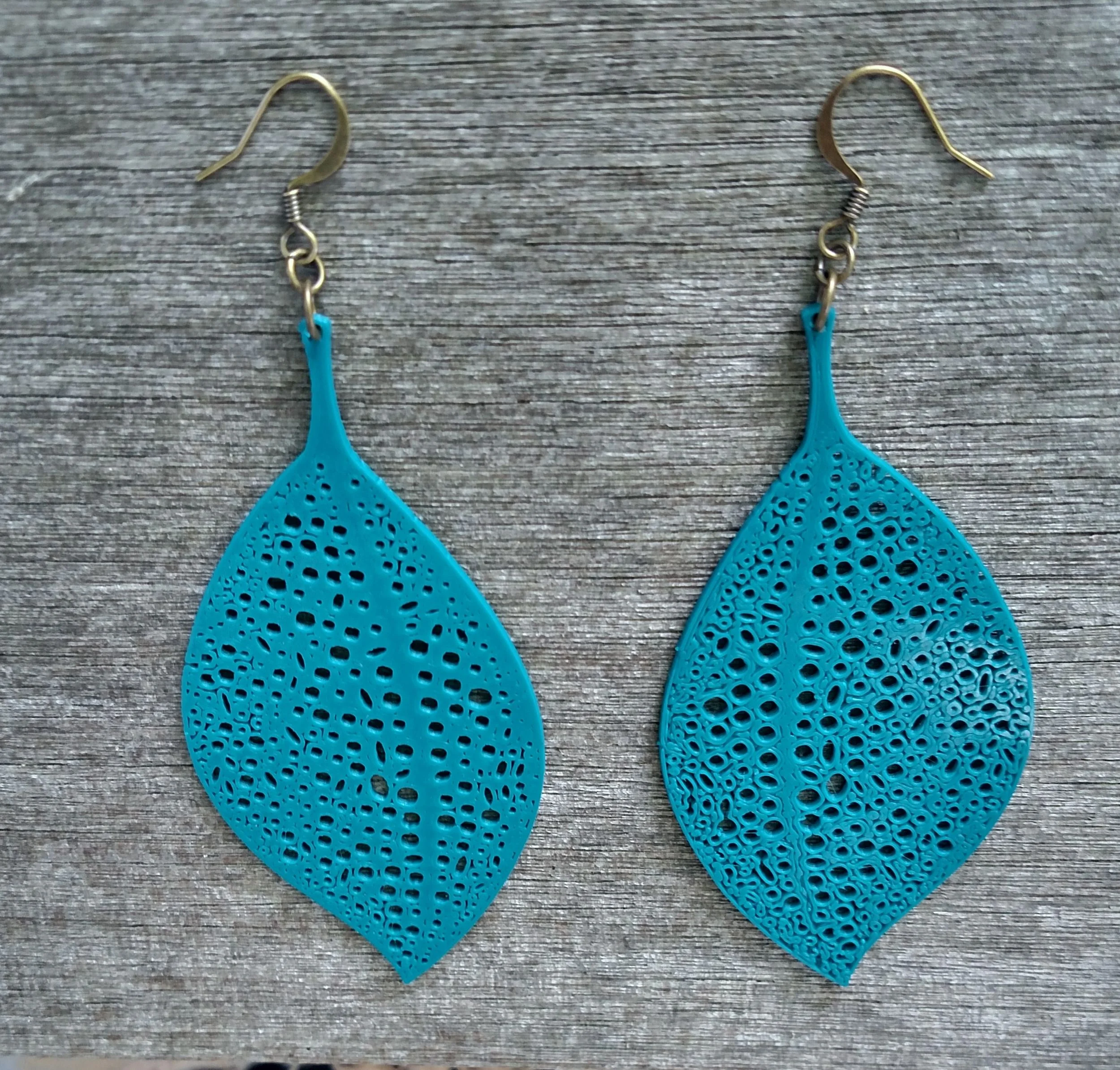 Dark Teal Catepillar Leaf Earrings Ear Top.jpg