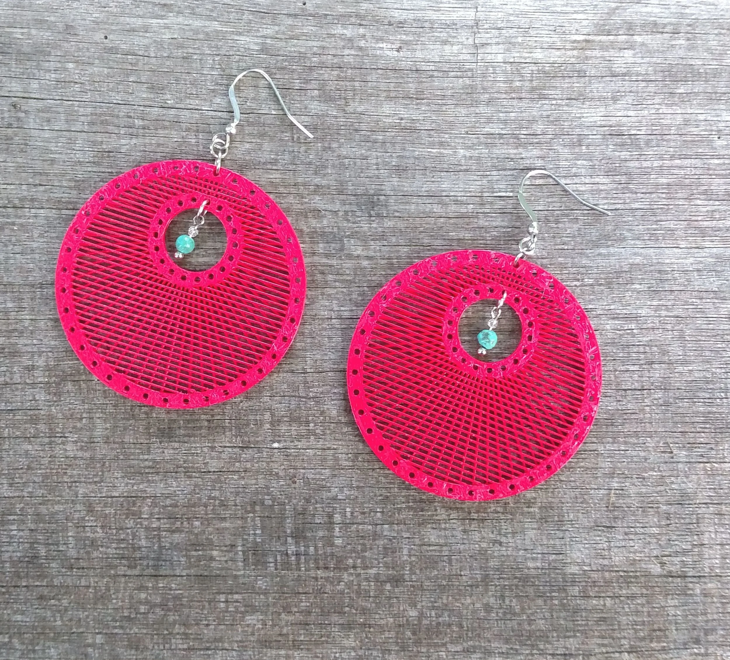 Miore Discs Red with Teal Bead wood.jpg