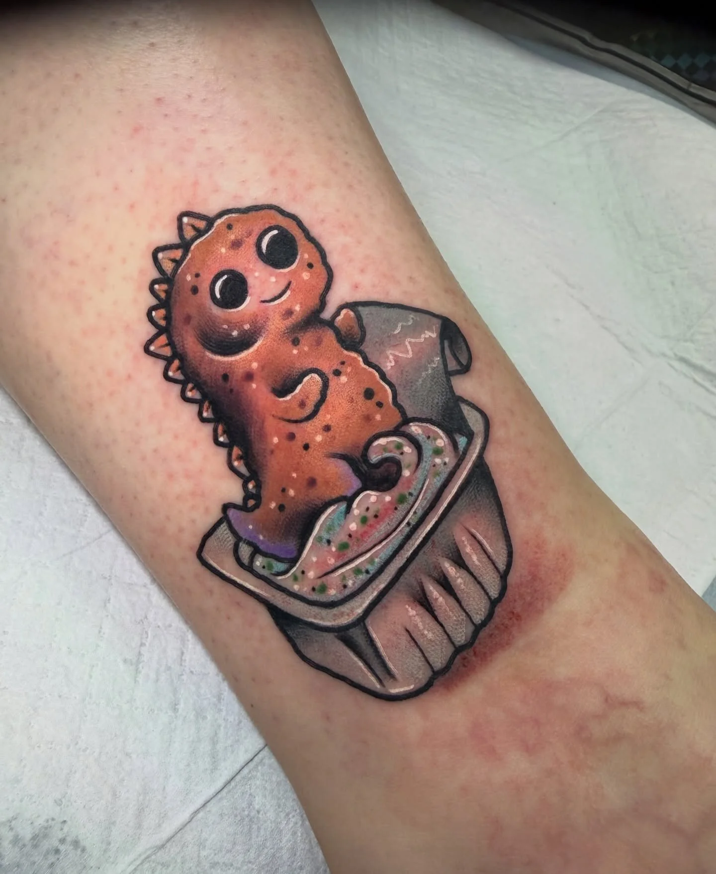 Dino nugget tattoo done by Mikey!