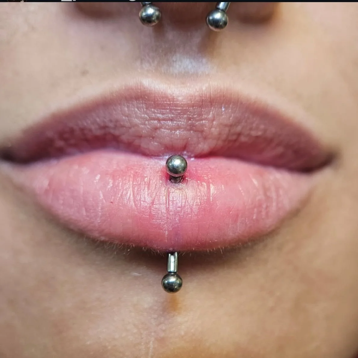 Vertical labret piercing done by Liam. We&rsquo;ve got walk-in availability for piercings and tattoos all weekend!