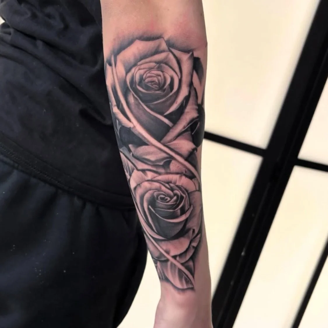Super smooth black and grey roses done by Carlos!