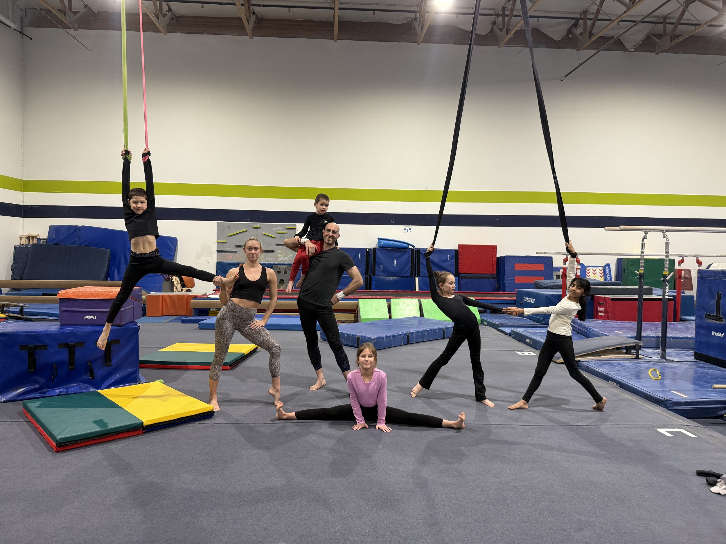 Child practicing aerial silks at Center Gravity summer camp