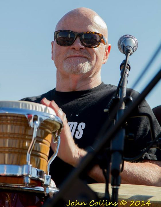 Sam beating on his drums.