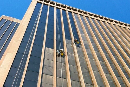 Clarity technician cleaning exterior windows on a commercial building in Salt Lake City