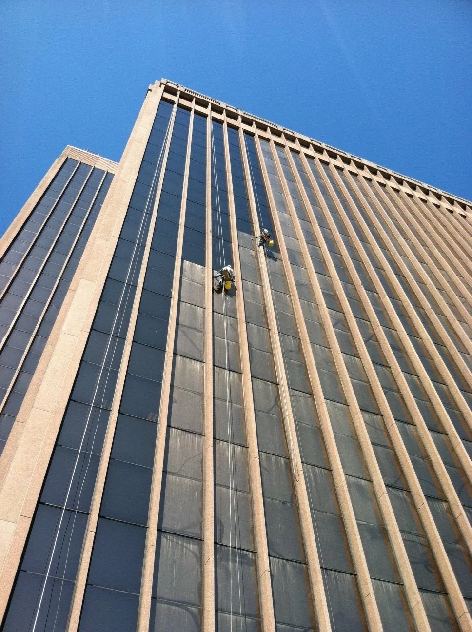 Clarity experts cleaning windows of a high rise in SLC