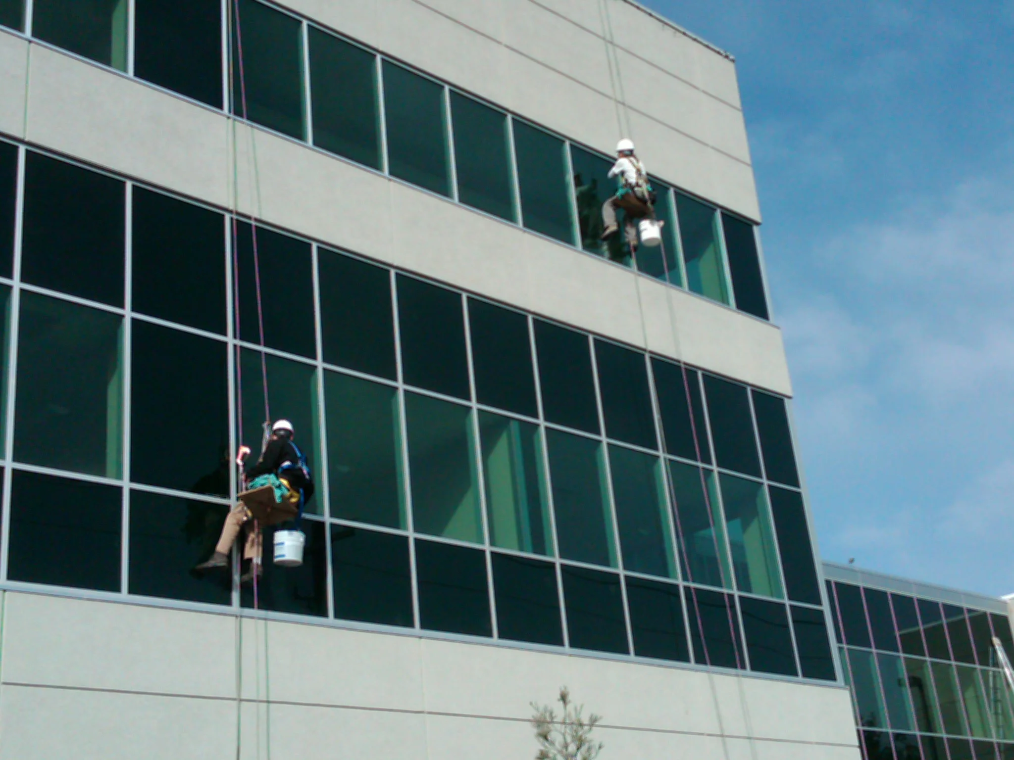 Clarity window experts cleaning corporate office exterior