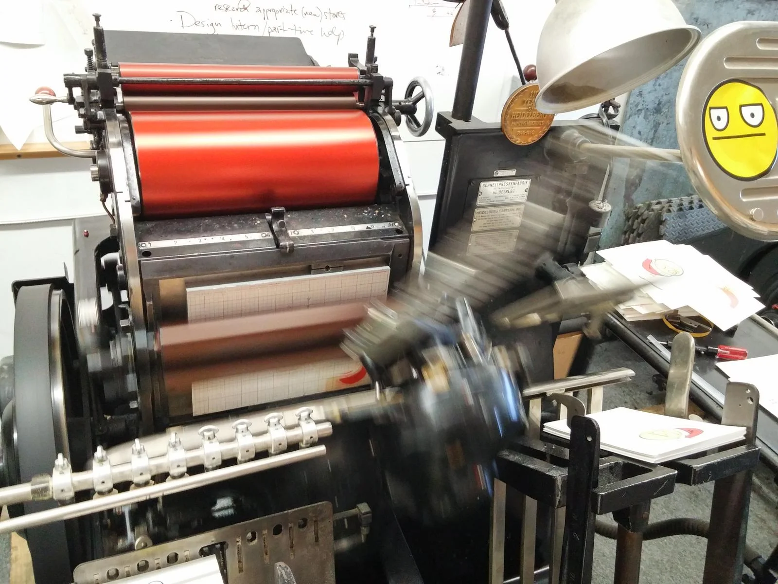 The hat, press mark and inside words will be printed in red