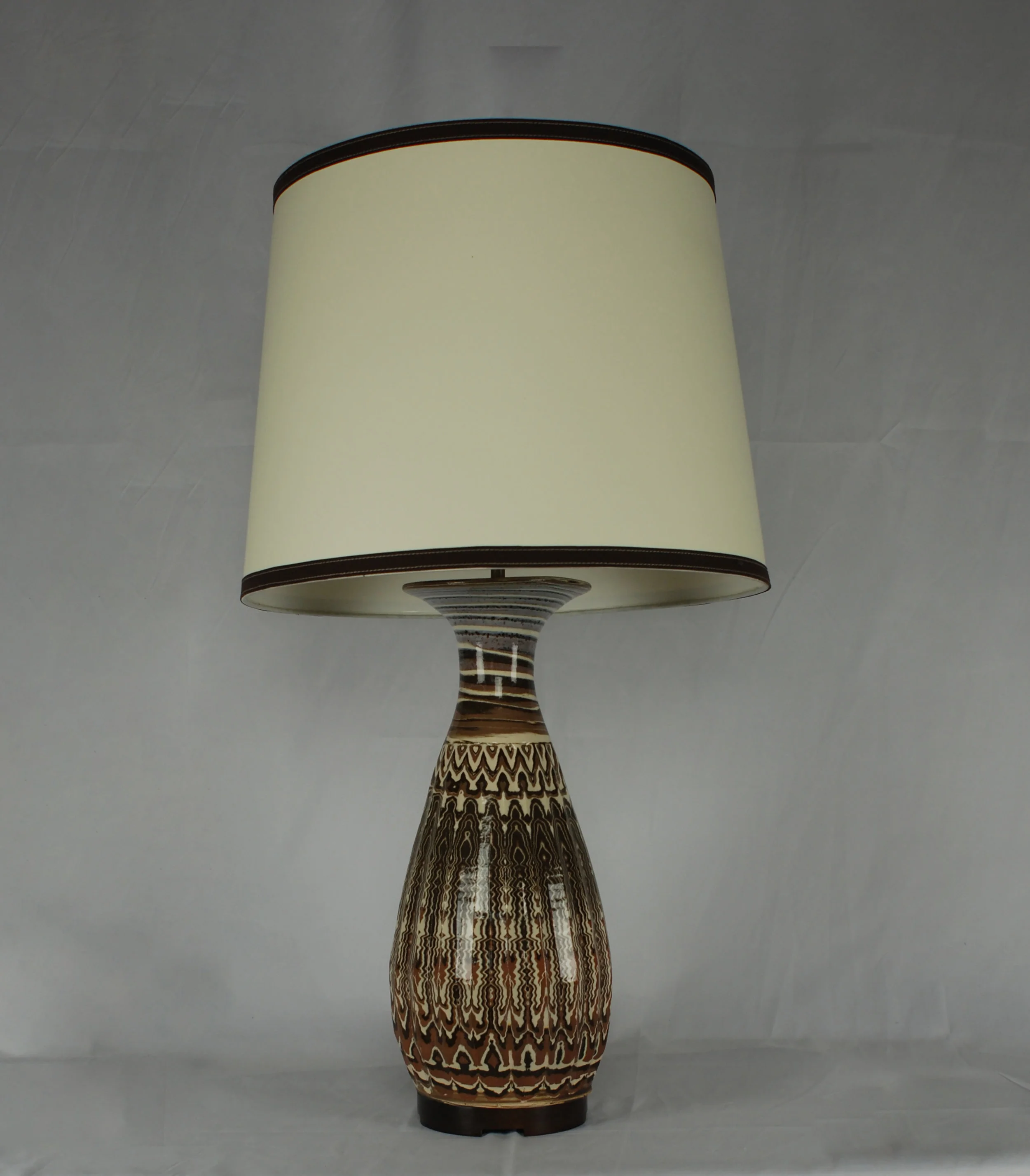 Karnak table lamp in agateware clay and clear glaze 1" tall reclaimed walnut base with paper parchment drum shade with coco Ultrasuede trimming.